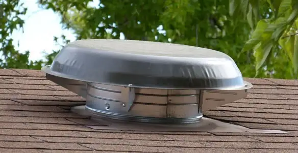 attic fan installation services with low-profile roof ventilation unit in Orange, CA