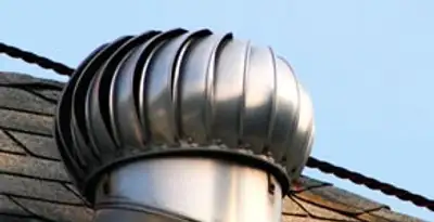 attic fan installation services with professionally installed roof ventilation unit in Orange, CA