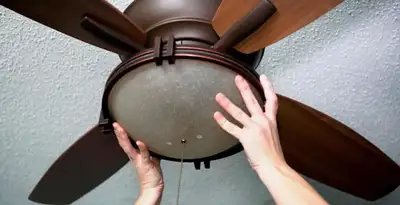 Ceiling fan repair and reinstallation on ceiling mount in Orange, CA