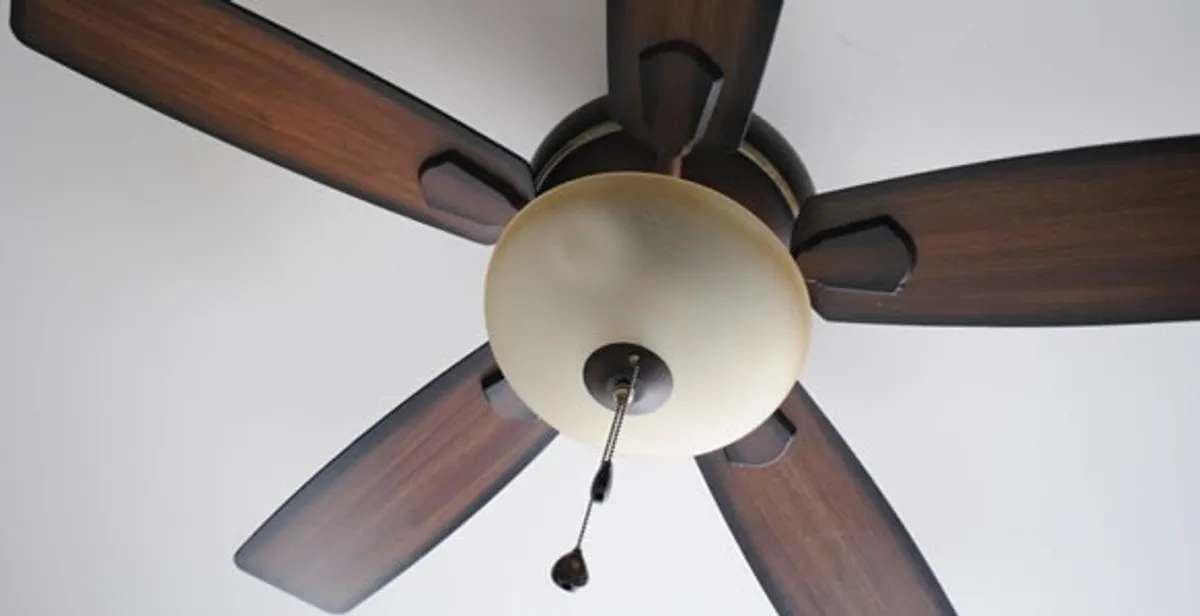Fully installed ceiling fan with balanced blades and light fixture in Orange, CA