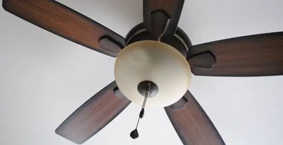 Fully installed ceiling fan with balanced blades and light fixture in Orange, CA