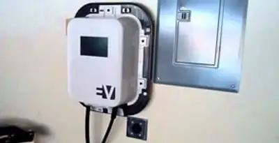 Electric car charger installation with wall-mounted EV charging station in Orange, CA