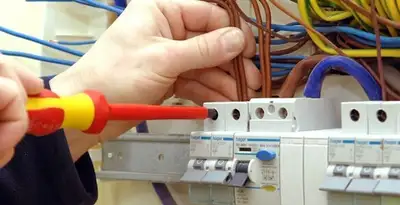electrician services performing professional electrical panel wiring and connections in Orange, CA