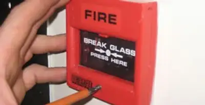 fire alarm installation service showing manual fire alarm pull station installed by licensed electricians in Orange, CA