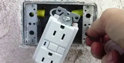 gfci circuits service showing installation of a ground fault circuit interrupter outlet by licensed electricians in Orange, CA
