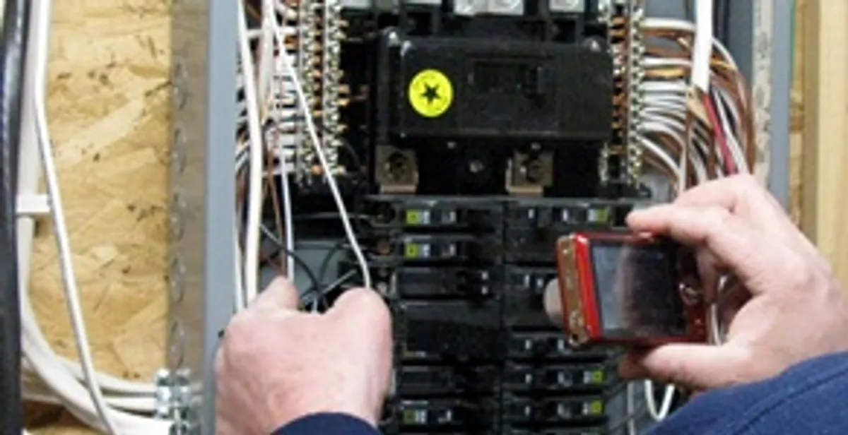 Home electrical inspection of circuit breaker panel by licensed electrician in Orange, CA