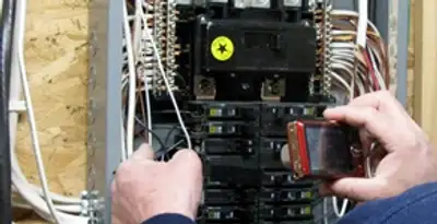 Home electrical inspection of circuit breaker panel by licensed electrician in Orange, CA