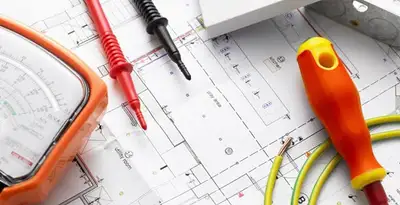 licensed electrician planning and testing electrical systems using professional tools in Orange, CA