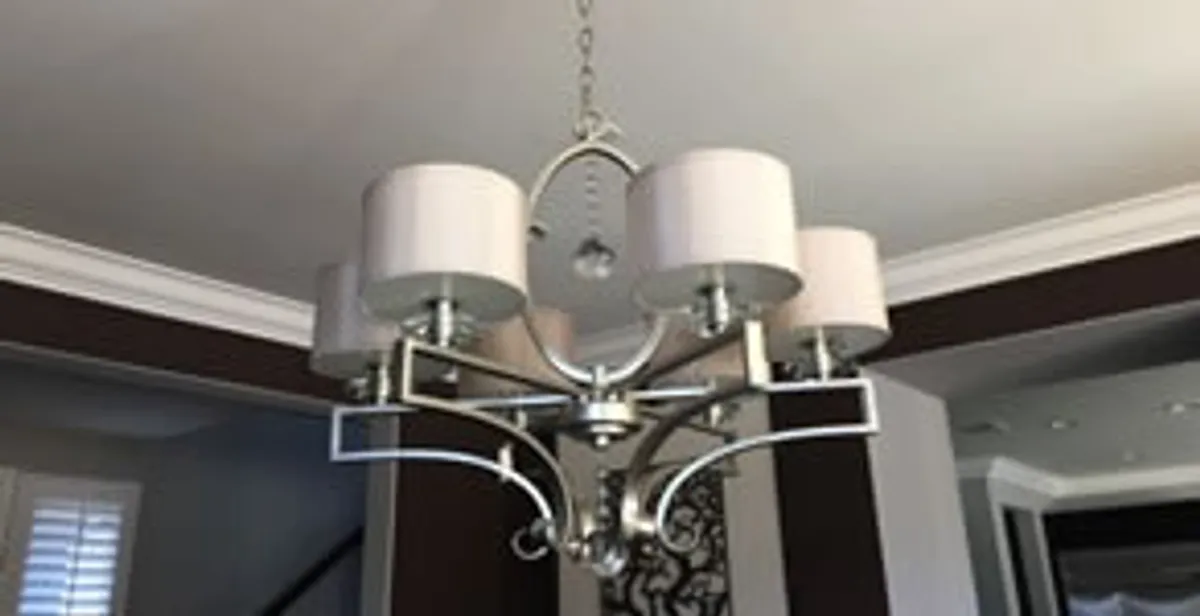 Modern chandelier installation with multiple light fixtures in Orange, CA