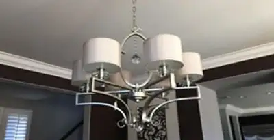 Modern chandelier installation with multiple light fixtures in Orange, CA