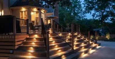 Residential electrician installing outdoor lighting for home safety in Orange, CA