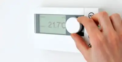 Thermostat installation service with professional adjusting temperature control in Orange, CA