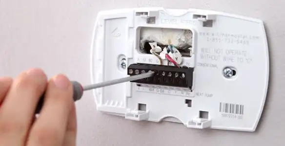 Thermostat installation service with proper wiring and secure wall mounting in Orange, CA